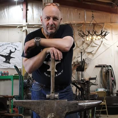 N.J. Pawley at the anvil